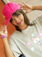 Teen Thai girl Tussinee in her pajamas and pink cap